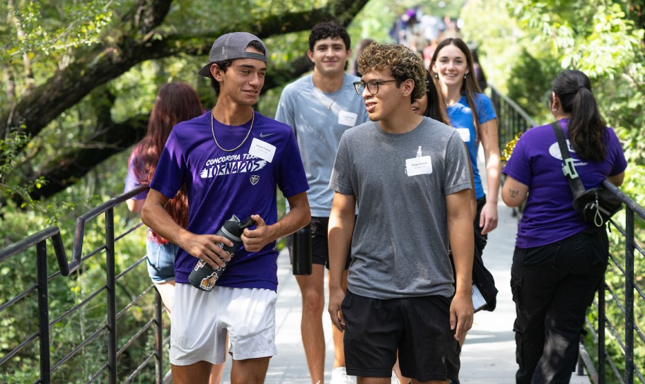 Students crossing the bridge on campus