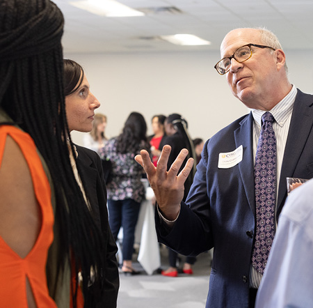 The President and Board Members conversing