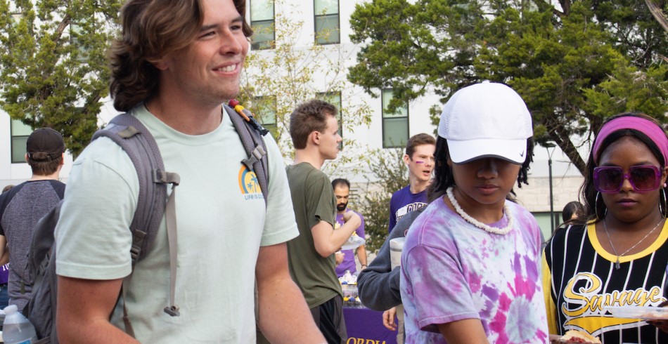 A group of students getting food at an event