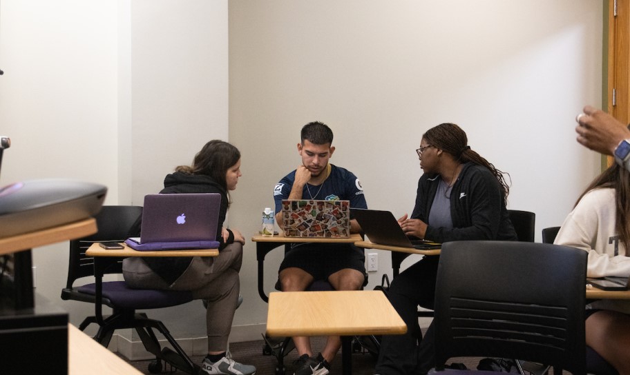 MEd students learning in a classroom
